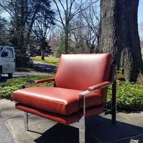 red leather chair reupholstered in recycled leather